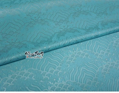 Tissu brocart à motif vagues turquoise : jacquard de soie et rayonne, 74 cm de large