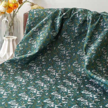 Tissu jacquard floral turquoise : matériau tissé couleur pour la couture et l'ameublement