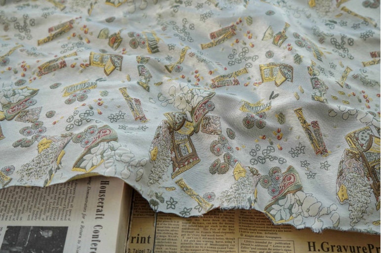 Tissu jacquard lurex blanc : polyester tissé gaufré 3D, 165 cm de large