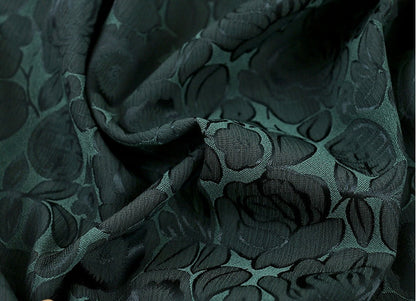 Tissu imprimé floral vert foncé : mélange bicolore de polyester et d’élasthanne, 150 cm de large