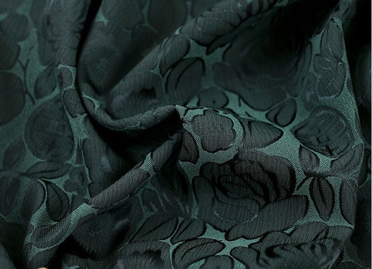 Tissu imprimé floral vert foncé : mélange bicolore de polyester et d’élasthanne, 150 cm de large