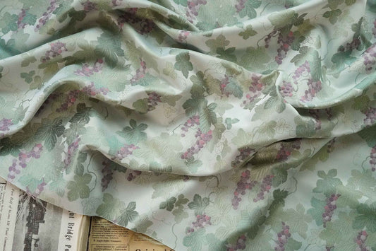 Tissu jacquard raisin : polyester gaufré doré et bronzé