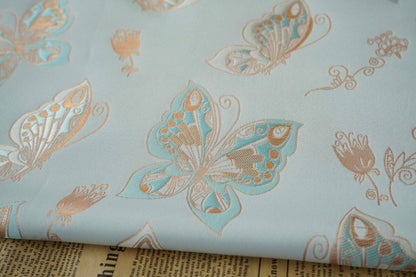 Tissu jacquard à motif papillons et feuille d'or Aqua : chenille pour ameublement, 142 cm de large