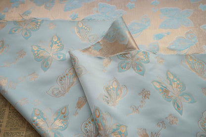 Tissu jacquard à motif papillons et feuille d'or Aqua : chenille pour ameublement, 142 cm de large