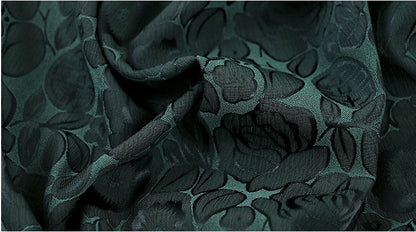 Tissu imprimé floral vert foncé : mélange bicolore de polyester et d’élasthanne, 150 cm de large
