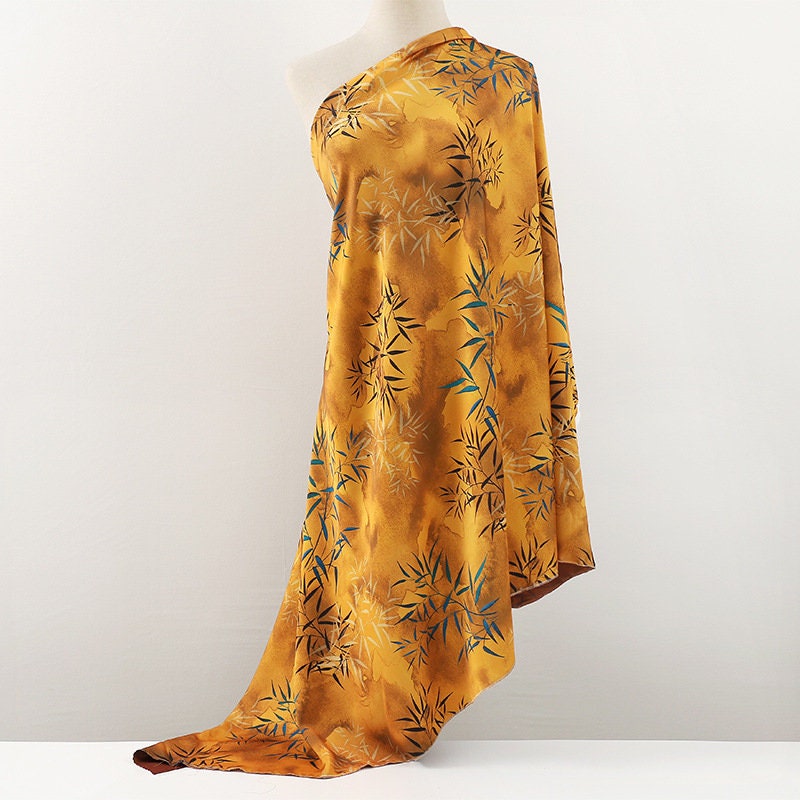 Tissu imprimé floral bambou : mélange de polyester et d’élasthanne bleu, 150 cm de large