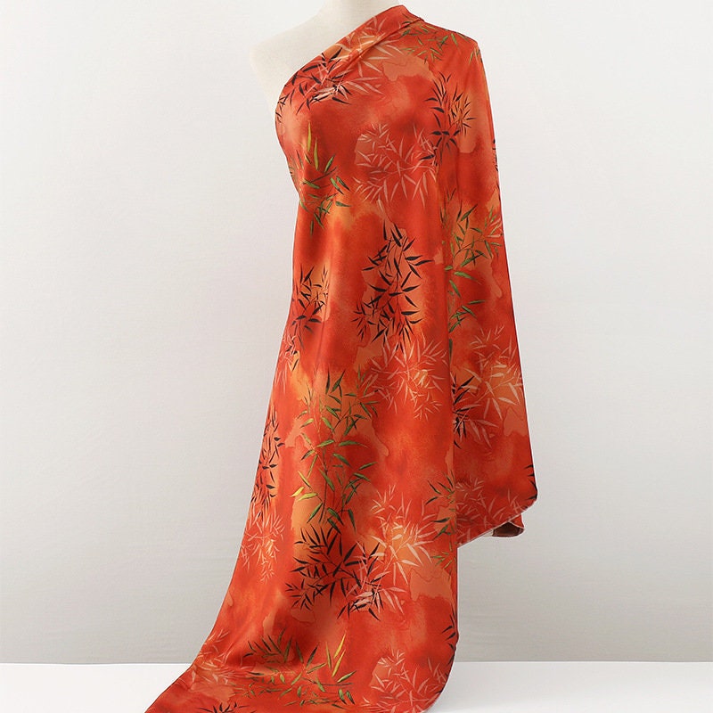 Tissu imprimé floral bambou : mélange de polyester et d’élasthanne bleu, 150 cm de large