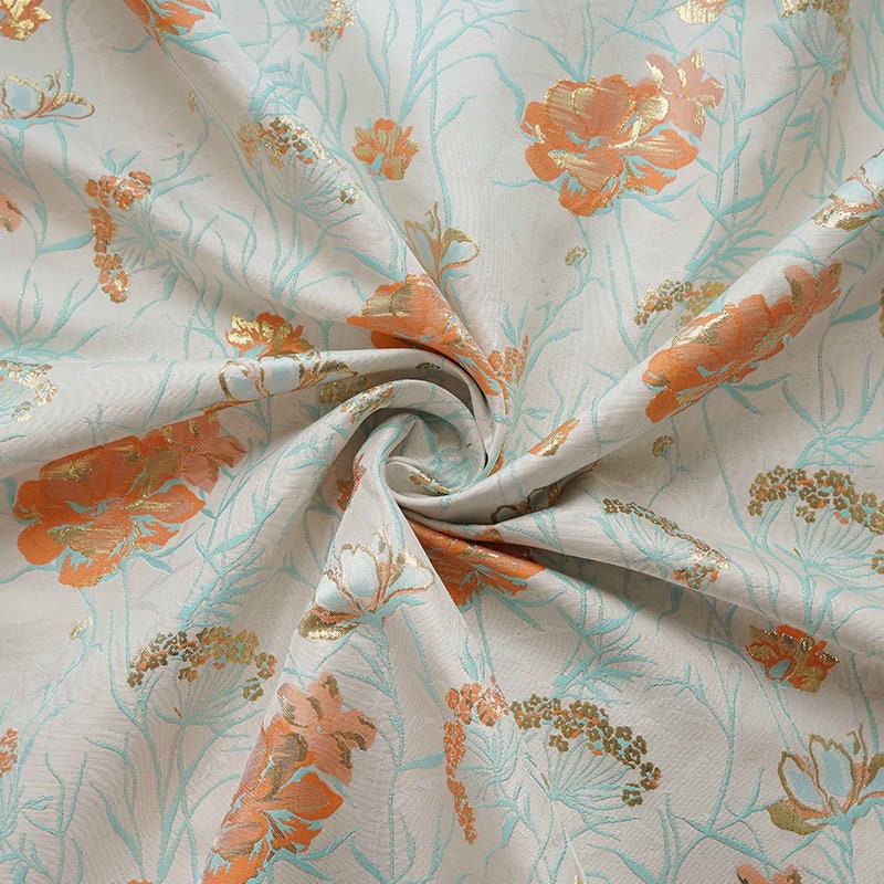 Tissu jacquard floral à fil doré : texture 3D, largeur 140 cm
