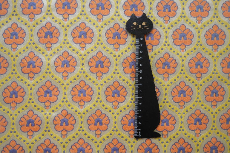 Tissu jacquard réversible : motif rétro orange en relief, 165 cm de large