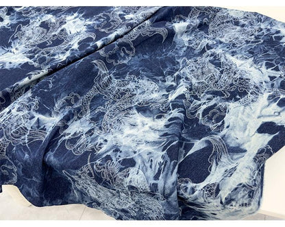 Tissu denim en coton délavé tie-dye : matière jean bleu délavé (170 cm de large)