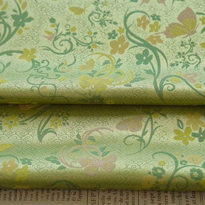 Tissu brocart papillon vert printemps : jacquard polyester de 165 cm de large