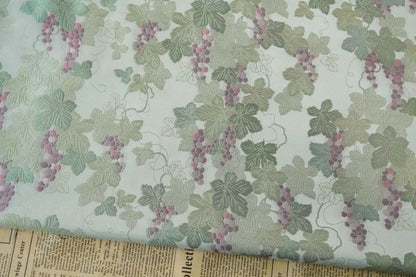 Tissu jacquard raisin : polyester gaufré doré et bronzé