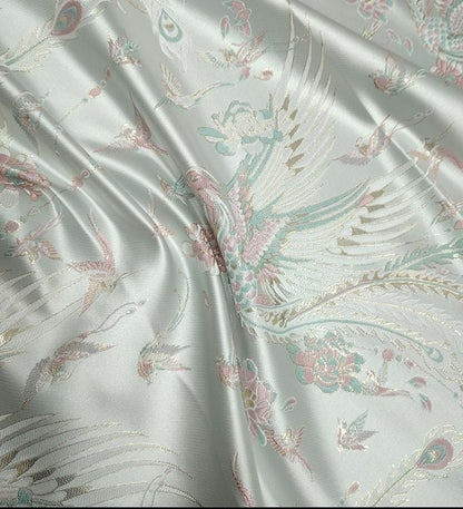 Tissu jacquard Queue de Phénix : motif fil doré 3D, 150 cm de large