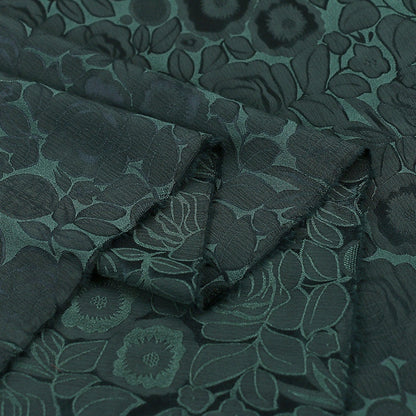 Tissu imprimé floral vert foncé : mélange bicolore de polyester et d’élasthanne, 150 cm de large