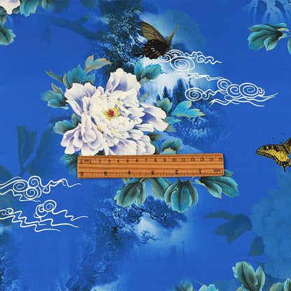 Tissu à imprimé floral papillon : Mélange de polyester et d'élasthanne bleu à motifs botaniques