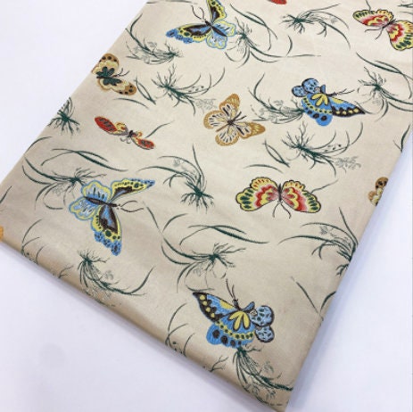 Tissu jacquard papillon : 145 cm de large, en polyester