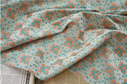 Tissu jacquard doré : motif totem asiatique ancien, 150 cm de large