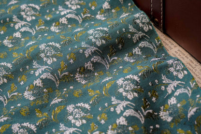 Tissu jacquard floral turquoise : matériau tissé couleur pour la couture et l'ameublement