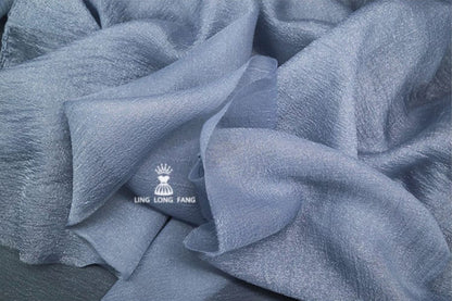Tissu organza nacré seersucker : 150 cm de large, mélange coton-polyester