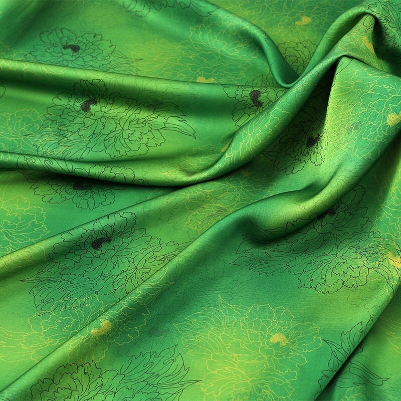 Tissu à imprimé floral pivoine : mélange de polyester et d’élasthanne vert à motifs botaniques, 150 cm de large