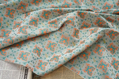 Tissu jacquard doré : motif totem asiatique ancien, 150 cm de large