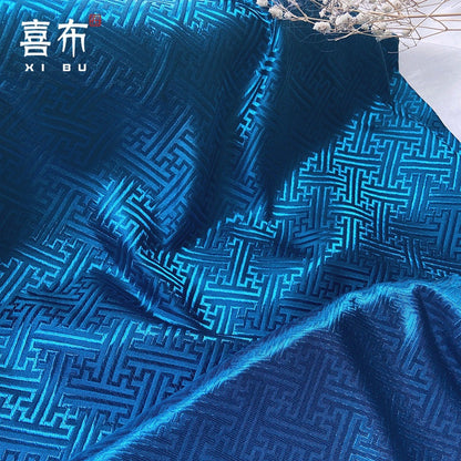 Tissu brocart chinois turquoise : motif frise, 150 cm de large, pour costumes et décoration