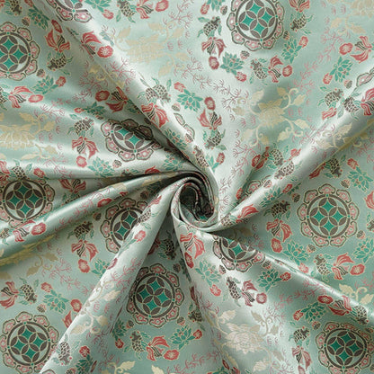 Tissu jacquard réversible bleu turquoise : motif poissons en relief, 165 cm de large