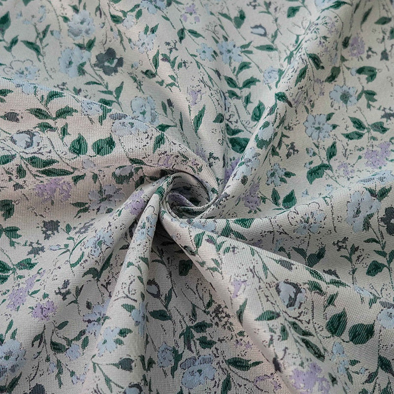 Tissu jacquard à motif floral : polyester texturé 3D, largeur 142 cm