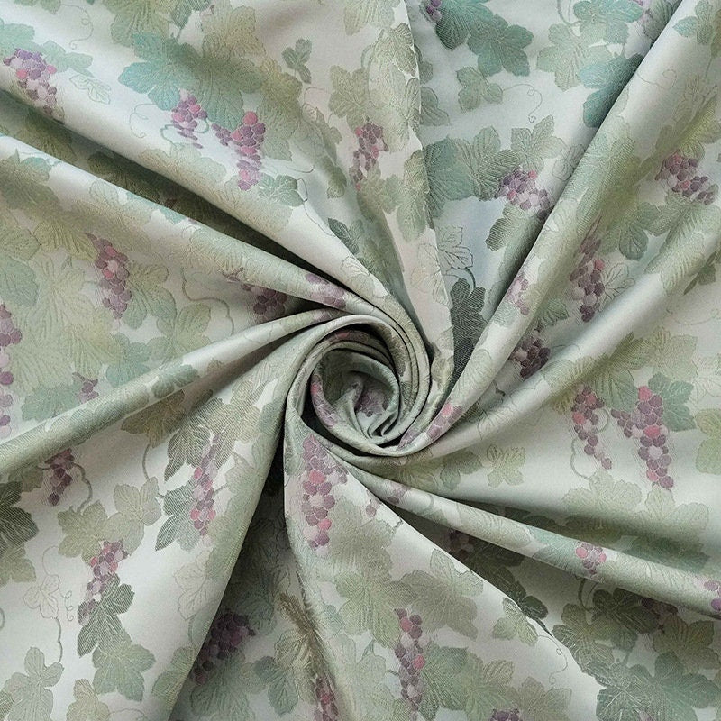 Tissu jacquard raisin : polyester gaufré doré et bronzé