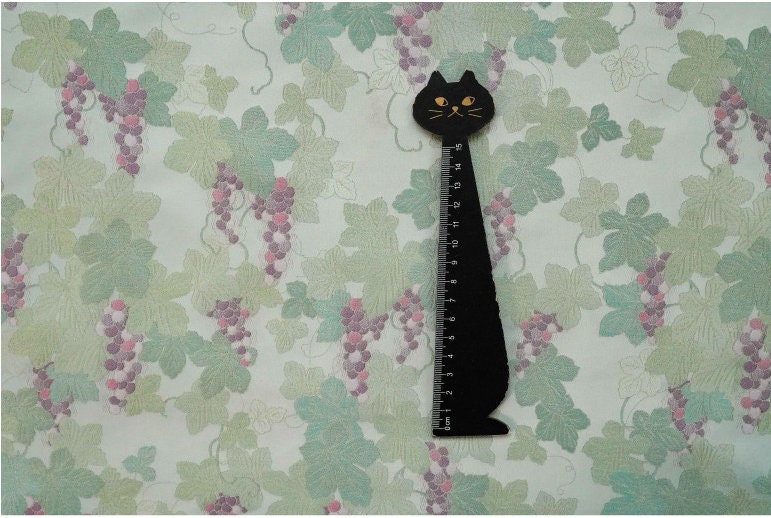 Tissu jacquard raisin : polyester gaufré doré et bronzé