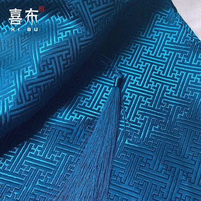 Tissu brocart chinois turquoise : motif frise, 150 cm de large, pour costumes et décoration