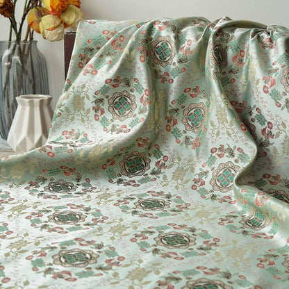 Tissu jacquard réversible bleu turquoise : motif poissons en relief, 165 cm de large