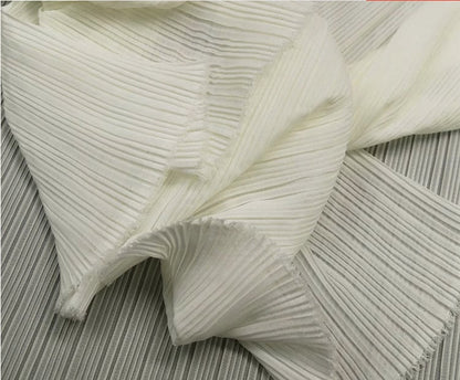 Tissu mousseline plissé : 150 cm de large, texture accordéon