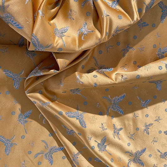 Tissu brocart papillon orange : jacquard imitation soie, 150 cm de large