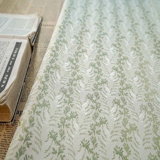 Tissu jacquard vert menthe : motif floral 3D, 165 cm de large