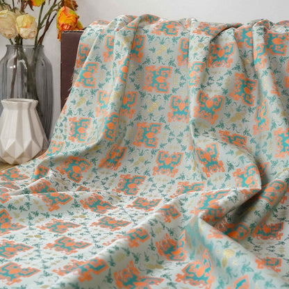 Tissu jacquard doré : motif totem asiatique ancien, 150 cm de large