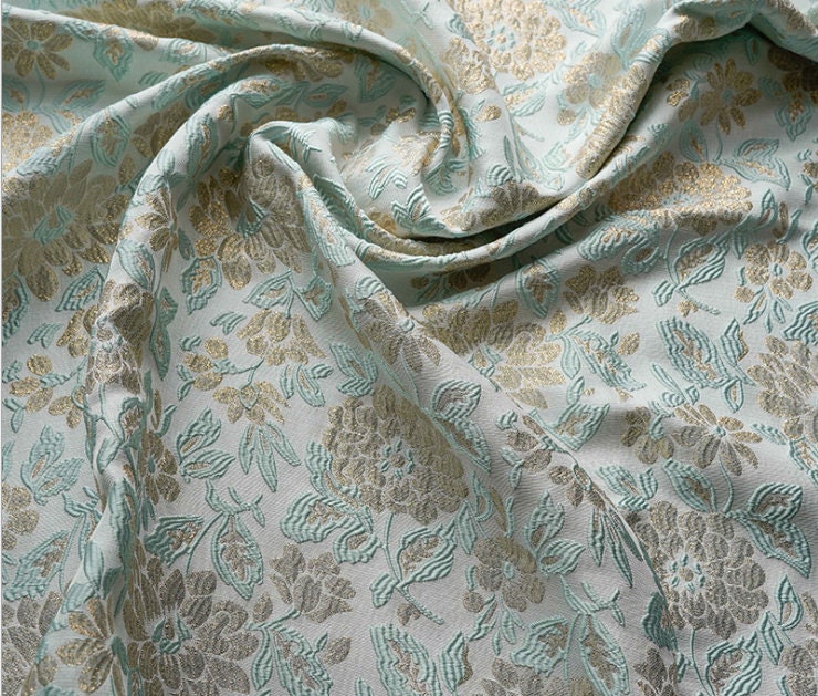 Tissu jacquard floral doré en relief : tissu 3D vert menthe, 140 cm de large