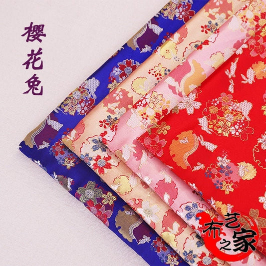 Tissu brocart jacquard Sakura Rabbit : rouge, rose, or, bleu (au mètre)