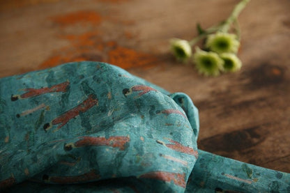 Tissu ramie imprimé Bouddha turquoise : 145 cm de large. Idéal pour l’ameublement, les costumes et la couture.
