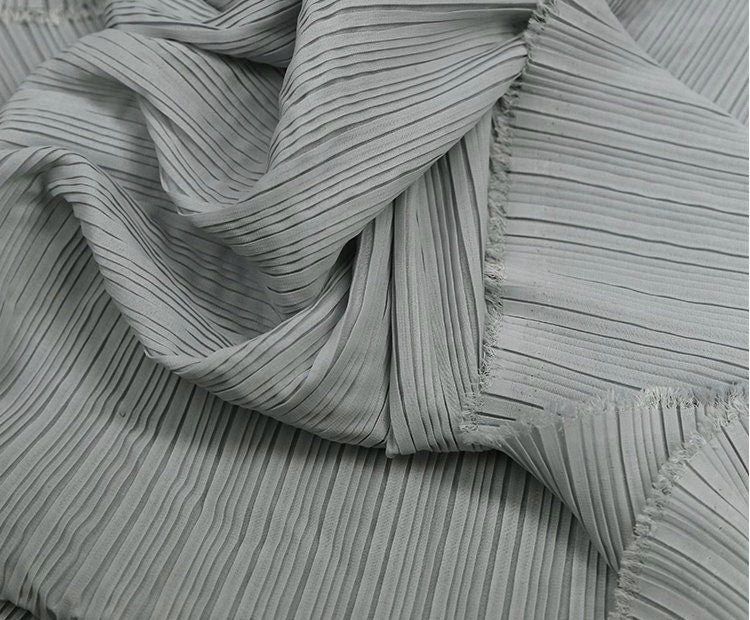 Tissu mousseline plissé : 150 cm de large, texture accordéon