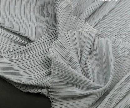 Tissu mousseline plissé : 150 cm de large, texture accordéon