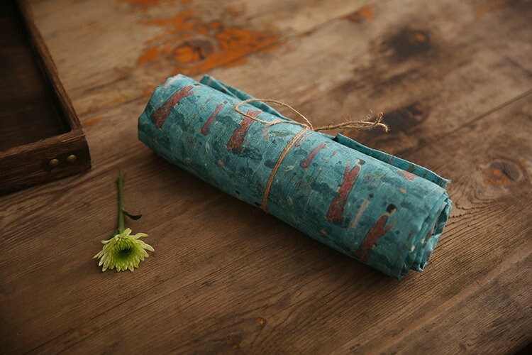 Tissu ramie imprimé Bouddha turquoise : 145 cm de large. Idéal pour l’ameublement, les costumes et la couture.