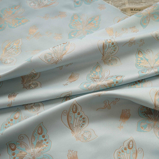 Tissu jacquard à motif papillons et feuille d'or Aqua : chenille pour ameublement, 142 cm de large