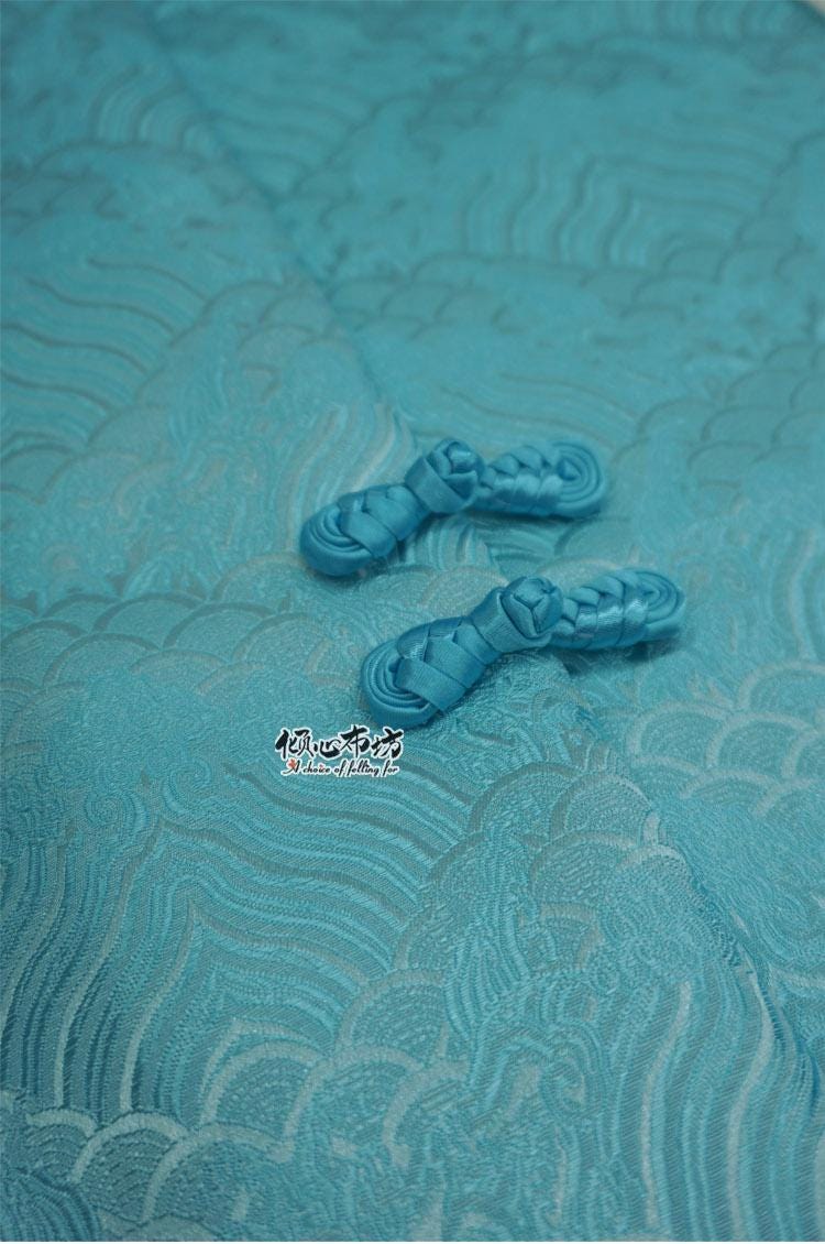 Tissu brocart à motif vagues turquoise : jacquard de soie et rayonne, 74 cm de large