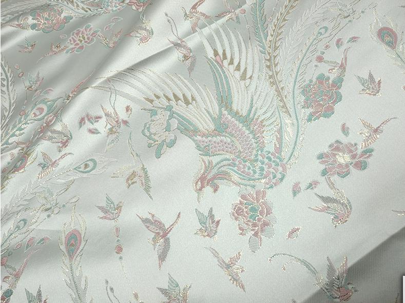 Tissu jacquard Queue de Phénix : motif fil doré 3D, 150 cm de large