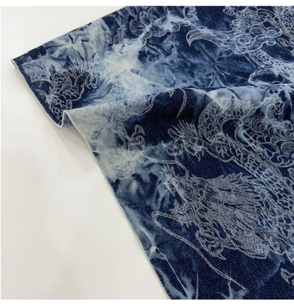Tissu denim en coton délavé tie-dye : matière jean bleu délavé (170 cm de large)