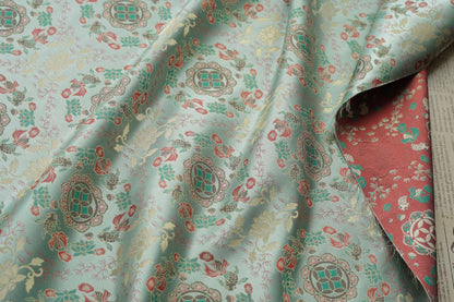 Tissu jacquard réversible bleu turquoise : motif poissons en relief, 165 cm de large