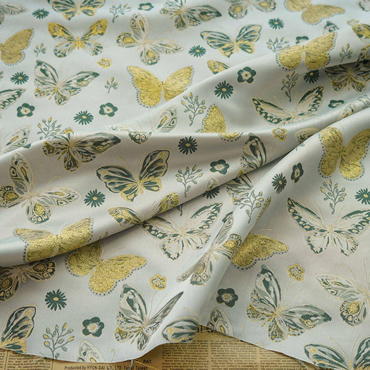 Tissu jacquard papillon à fil doré : tissu beige pour costumes et ameublement