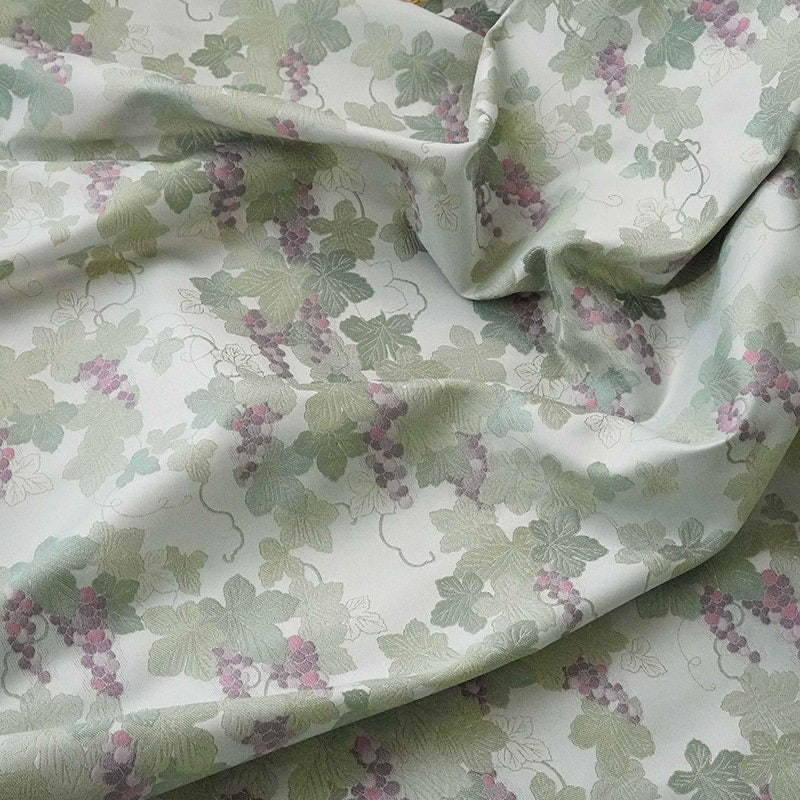 Tissu jacquard raisin : polyester gaufré doré et bronzé