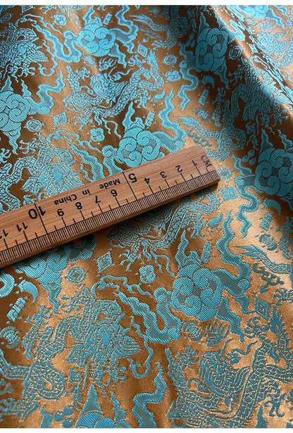 Tissu brocart bleu sarcelle à motif de dragon chinois : mélange de soie et de rayonne, 75 cm de large